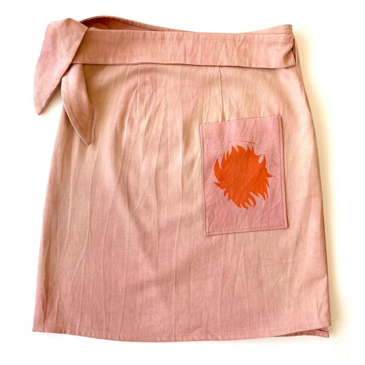 Pink hand dyed utilitarian Wrap Skirt with orange and blue block printed pattern -back - Austin Gift Shop