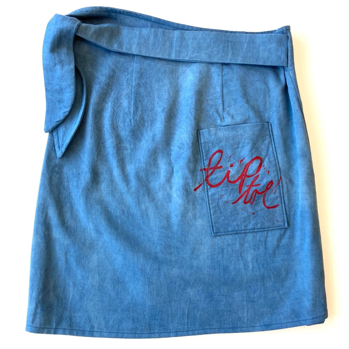 Blue hand dyed utilitarian Wrap Skirt with black and red block printed pattern - back - Austin Gift Shop